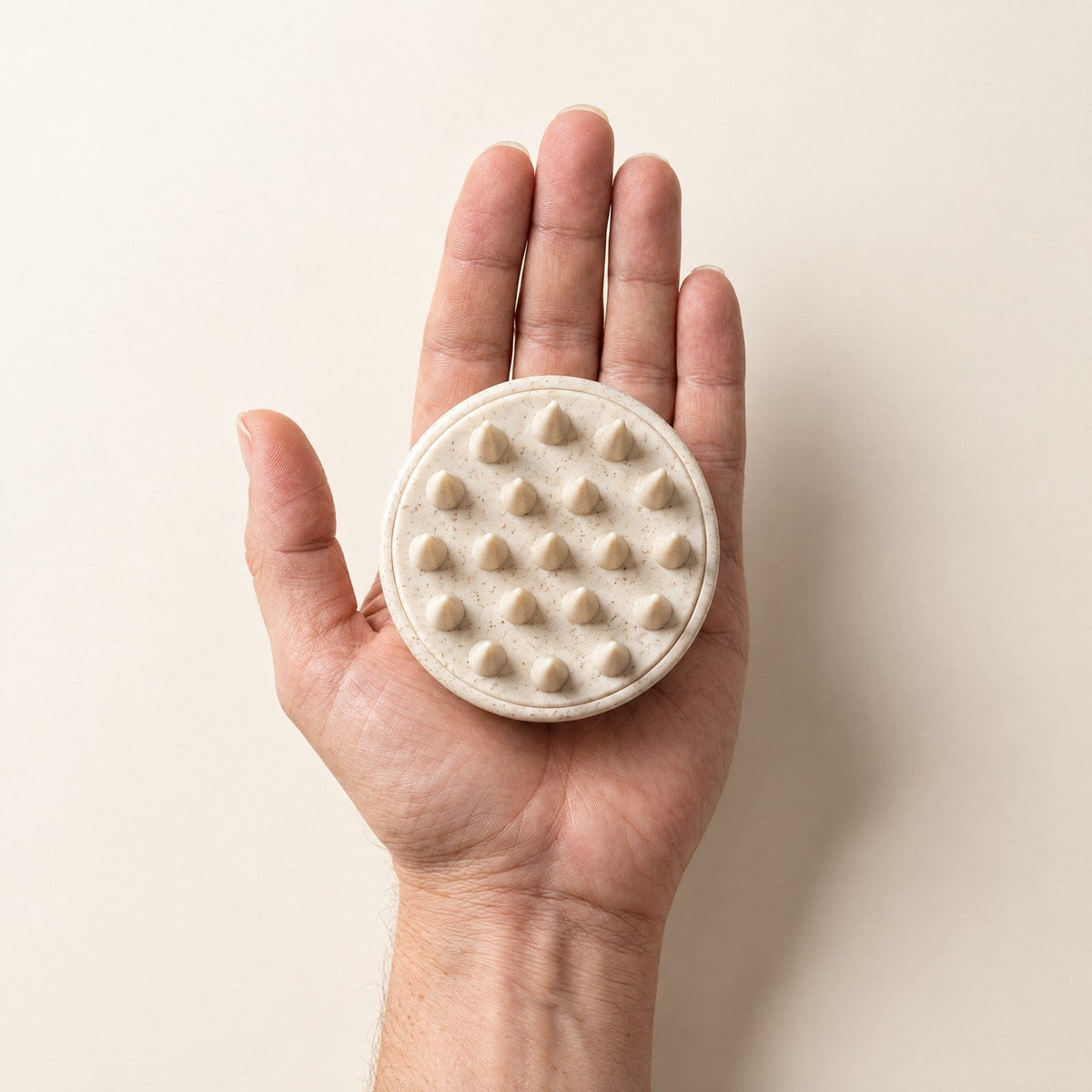 The scalp brush fits in one palm