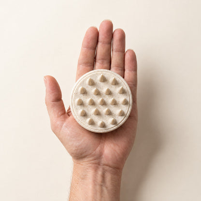 The scalp brush fits in one palm